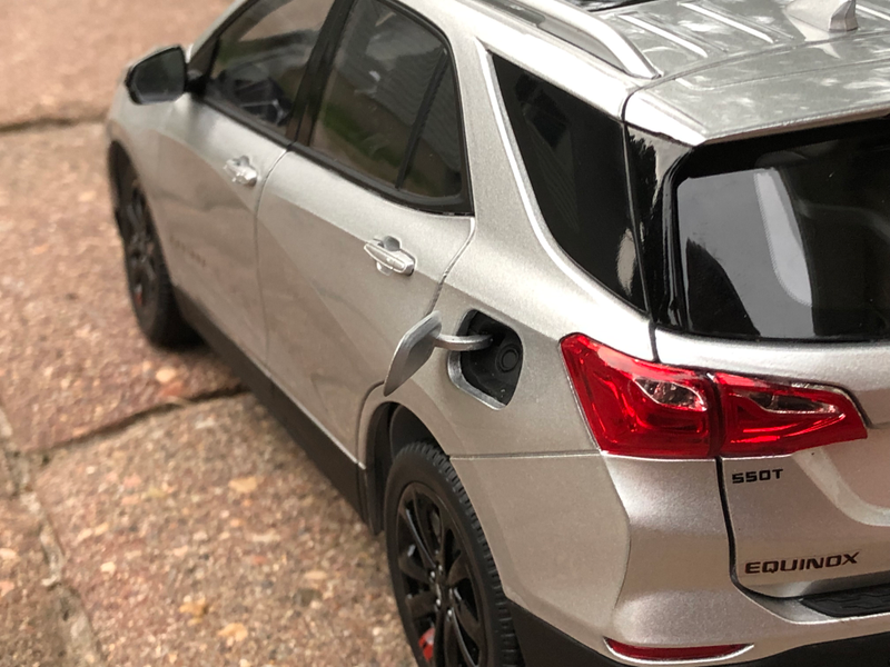 A remarkable touch for 1:18 scale. All four doors open, the hood (bonnet) and rear liftgate (boot) open, the fuel filler door opens, the steering wheel turns the wheels, the mirrors fold, and (AHH AutoArt cringe) this has WORKING SUSPENSION!